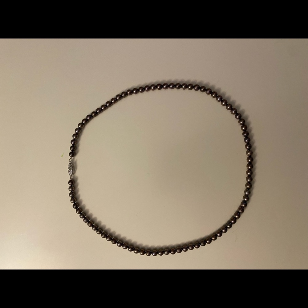 Thin black pearl necklace